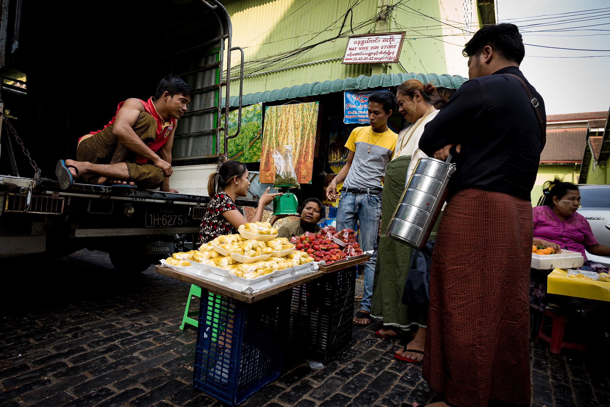 Fruit seller discussing their daily sales